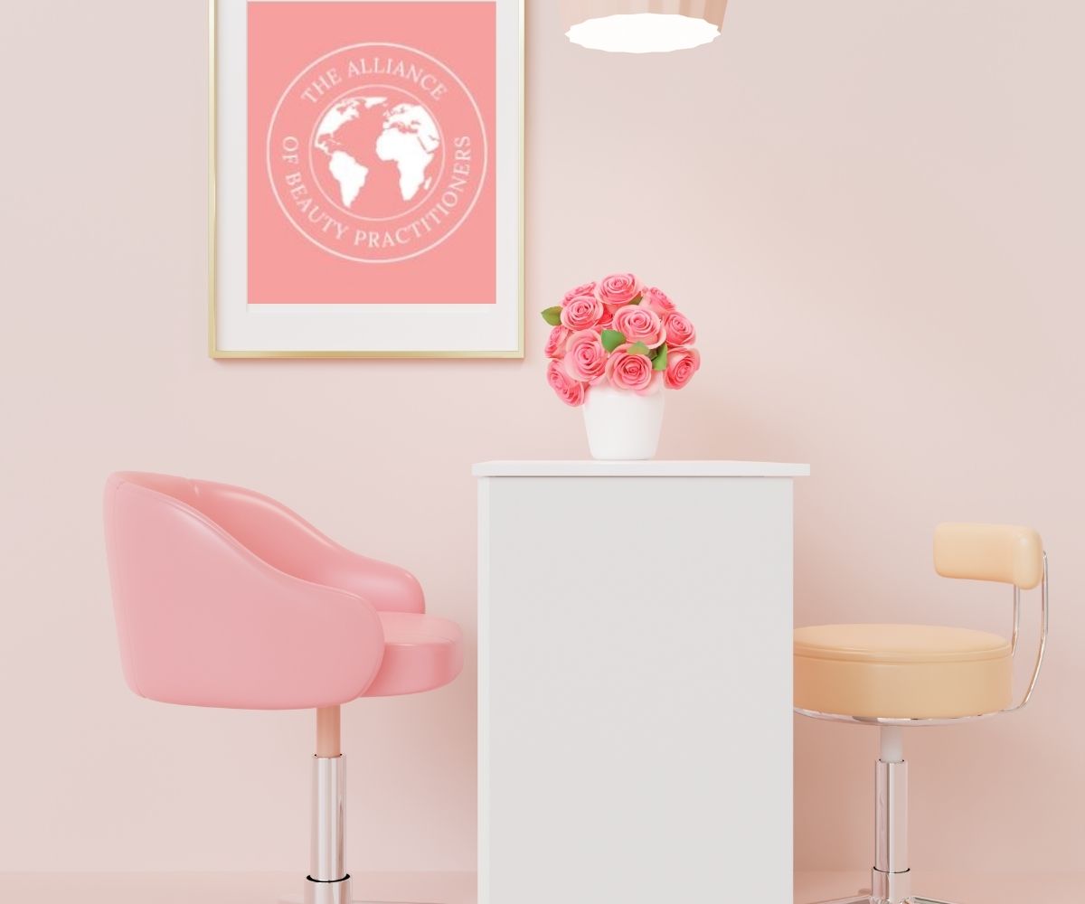 Beauty course manuals: a salon with one pink chair, one cream chair opposite each other with a white desk between them