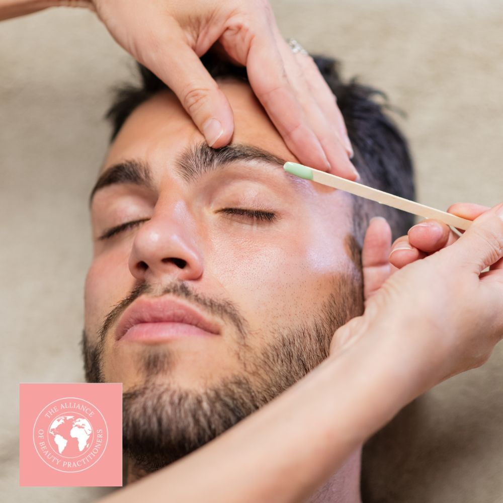 Our Beauty courses include waxing, like this male model is receiving on his eyebrows